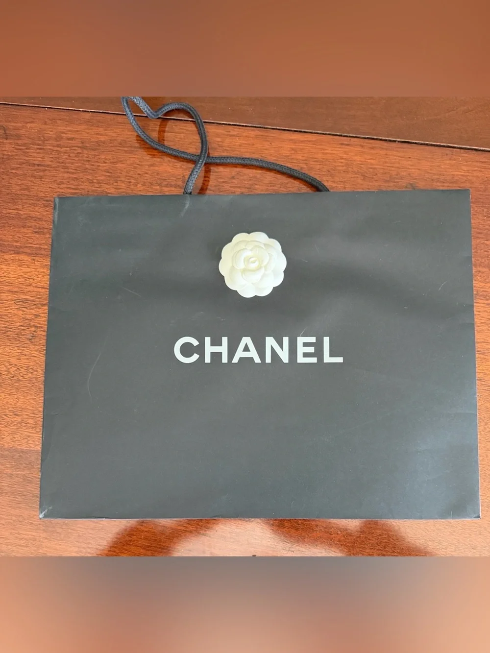 CHANEL Black Shopping Bag with White Camellia Accent